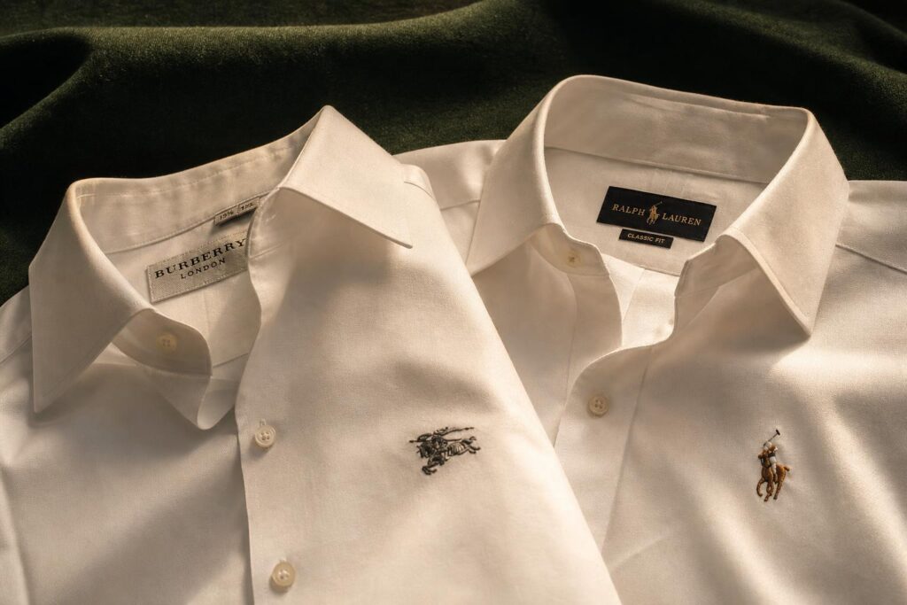Burberry knight and Ralph Lauren polo player embroideries on white Oxford shirts
